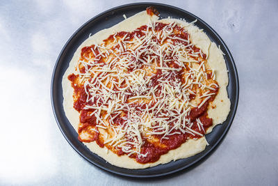 High angle view of pizza served on table