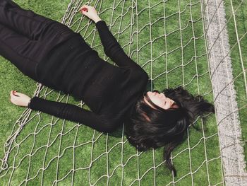 WOMAN STANDING ON GRASS