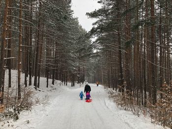 Girl on snow covered field