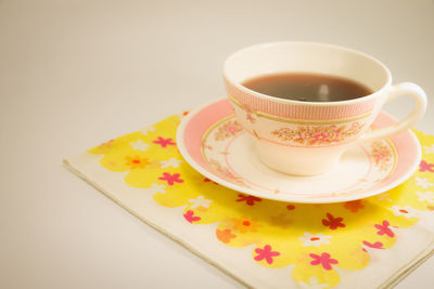 Close-up of coffee cup on table