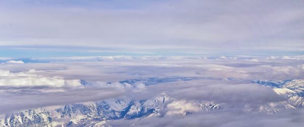 Wasatch front rocky mountain range aerial snow capped peaks winter urban salt lake city utah usa