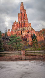 Scenic view of mountains against cloudy sky