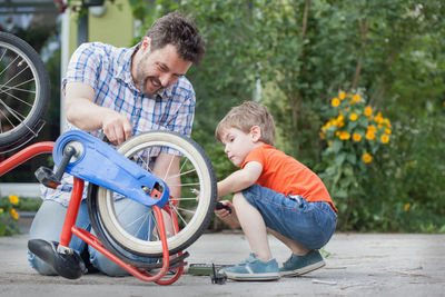 Father and son on vehicle