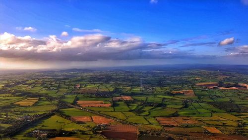 Aerial view of agricultural field against sky