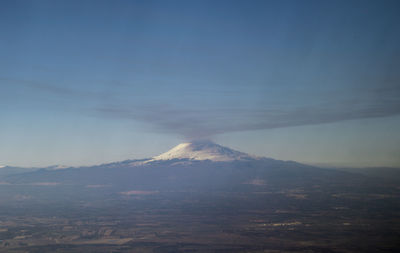 Scenic view of volcanic mountain against sky