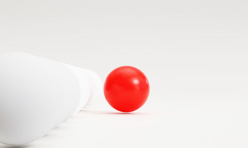 Close-up of red balloon against white background