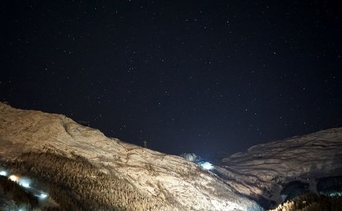 Low angle view of mountain against sky at night