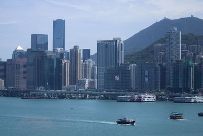 View of bay in city against sky