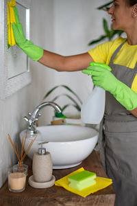 Midsection of woman working in kitchen