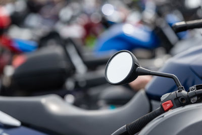 Close-up of motorcycle parked on road