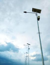 Low angle view of street light against sky