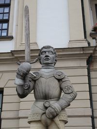 Low angle view of statue against building