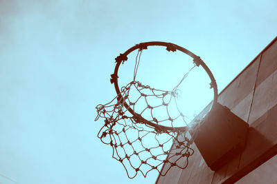 Low angle view of basketball hoop against sky