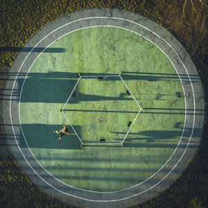 Directly above shot of man playing at field 