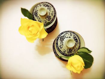 High angle view of yellow and drink on table