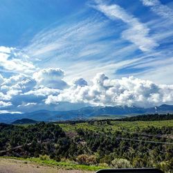 Scenic view of landscape against cloudy sky