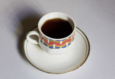 High angle view of coffee cup on table