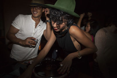 Young woman djing at a club