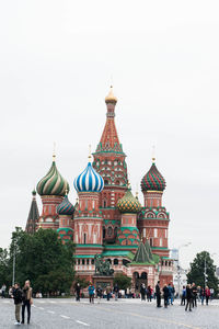 People walking in front of building