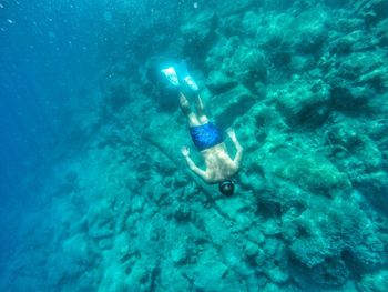 Man diving under sea