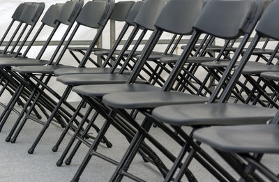 Empty chairs and tables in restaurant