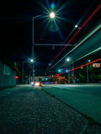 Illuminated city street at night