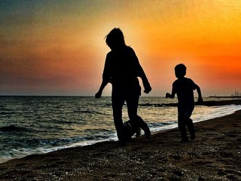 Silhouette of people on beach