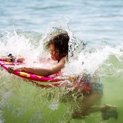 Girl surfing in sea