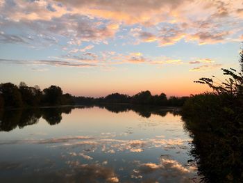 Scenic view of lake against sky during sunset