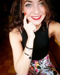 Close-up portrait of smiling young woman