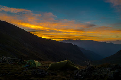 Scenic view of mountains against sky during sunset