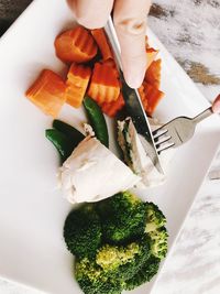 High angle view of person preparing food on table