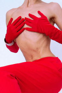 Fashion unrecognizable lady in retro red pants and gloves. minimalist elegant vintage details style.