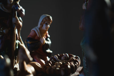 Close-up of nativity scene in darkroom