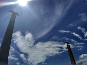 Low angle view of airplane flying against sky