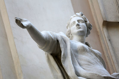 Close-up of statue against wall