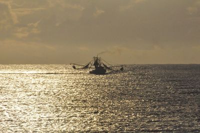 Scenic view of calm sea against sky