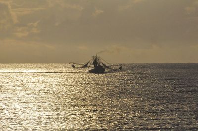 Scenic view of calm sea against sky