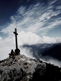 Low angle view of mountain against cloudy sky