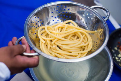 Close-up of person preparing food in kitchen