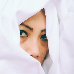 Close-up of woman covered in fabric