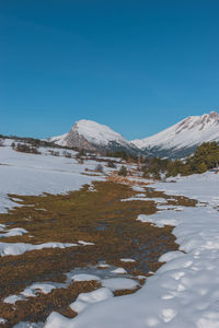 A picturesque vertical landscape view of the french alps mountains on a cold winter day