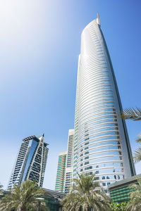 Low angle view of modern buildings against clear sky