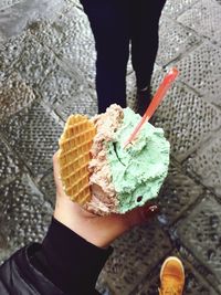 Close-up of woman holding ice cream cone