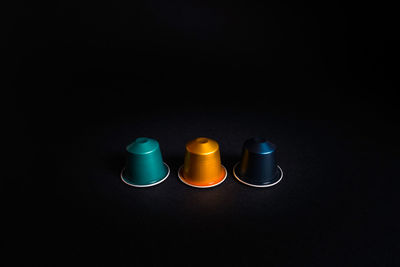 High angle view of glasses on table against black background