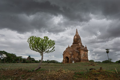 View of temple against cloudy sky