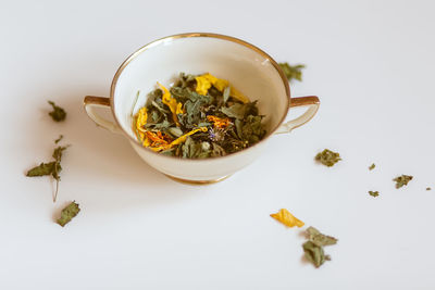 Close-up of tea cup against white background