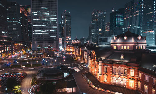 High angle view of illuminated buildings in city at night