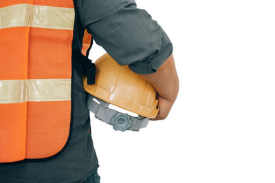 Rear view of man working over white background