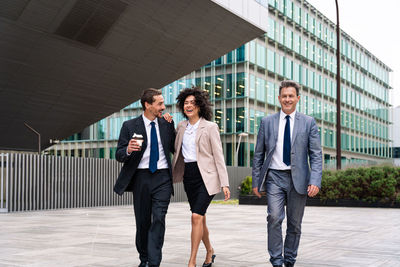 Portrait of business colleagues standing in city